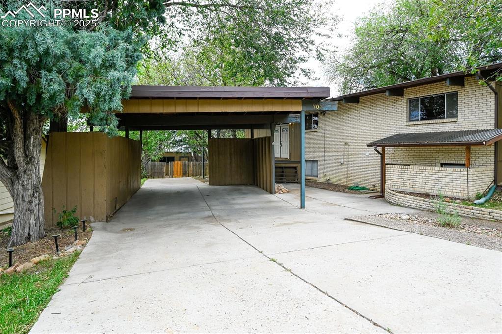 Image 3 of 44: Front w/carport