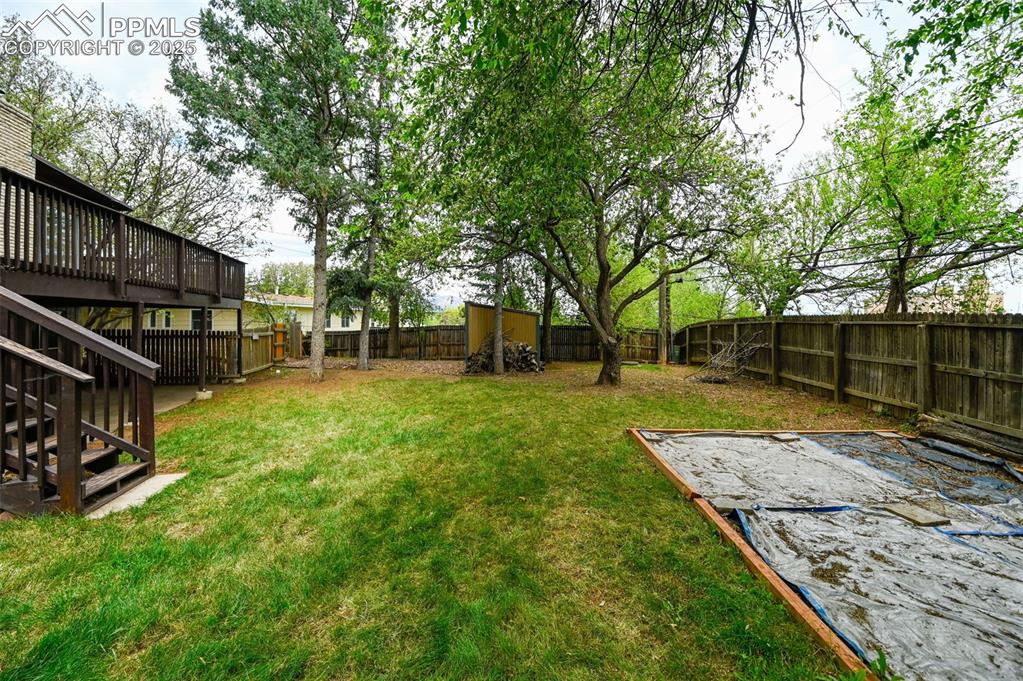 Image 41 of 44: Fenced backyard