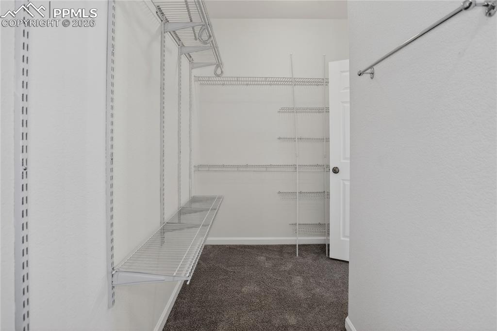 Image 14 of 35: Primary walk-in closet