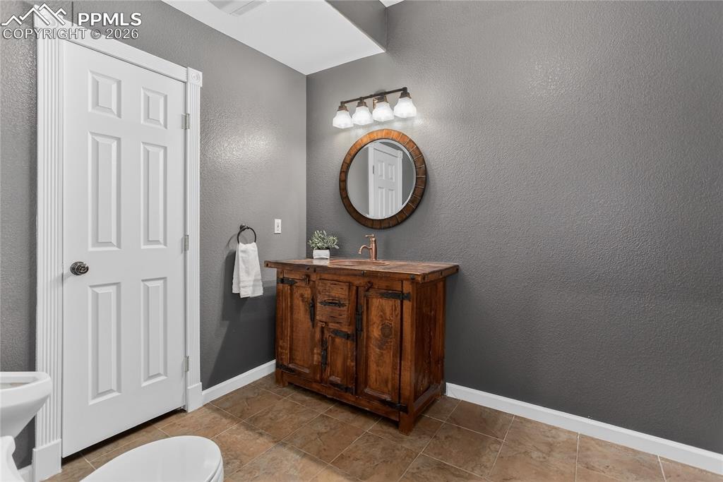 Image 23 of 35: Powder room - lower level