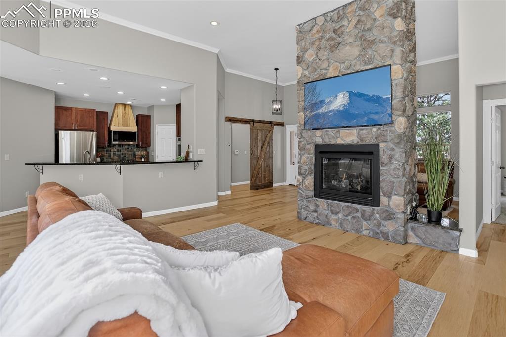 Image 7 of 35: Hardwood flooring through entertainment spaces