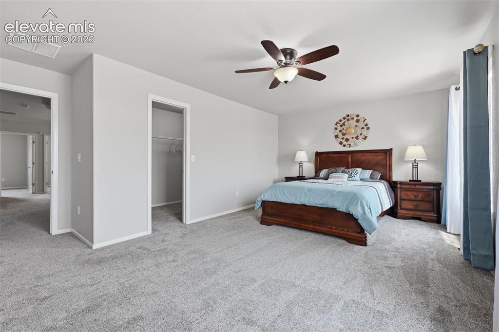 Image 23 of 29: Primary Bedroom with Spacious Walk-in Closet