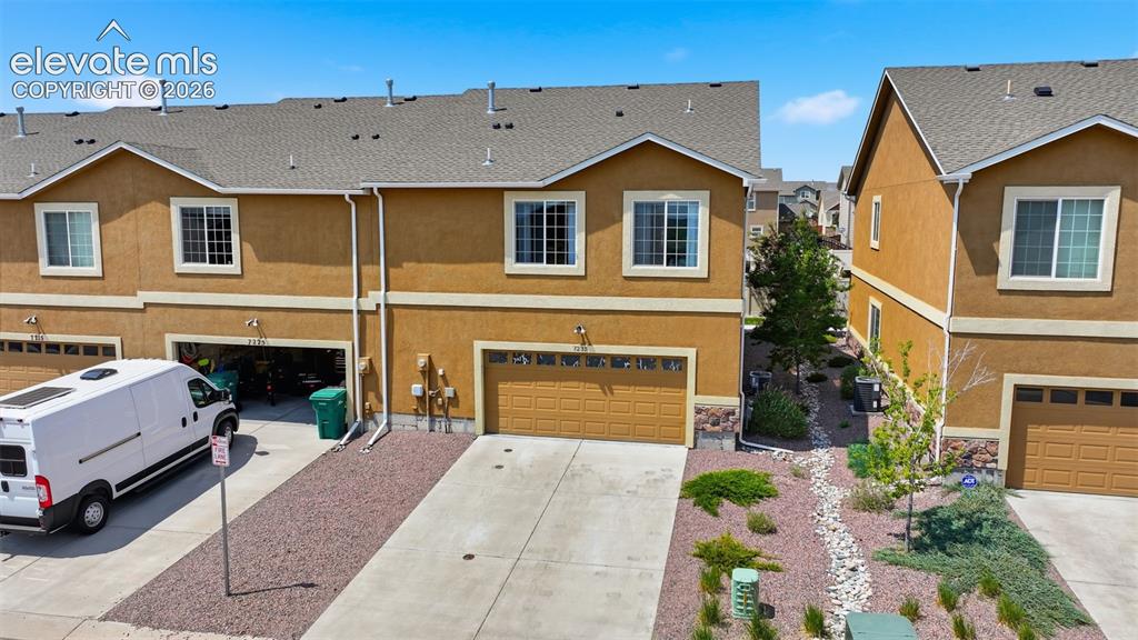 Image 27 of 29: Back view with spacious two car garage