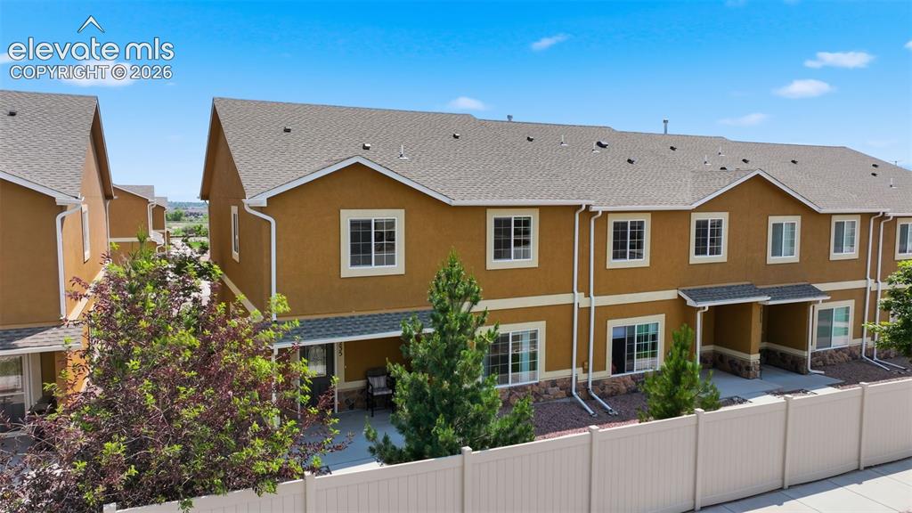 Image 29 of 29: Front View of the End Unit Townhome