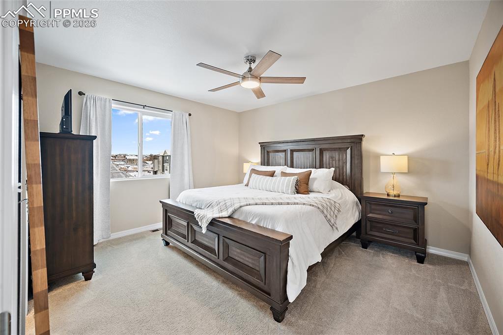 Image 16 of 47: Upper level primary bedroom