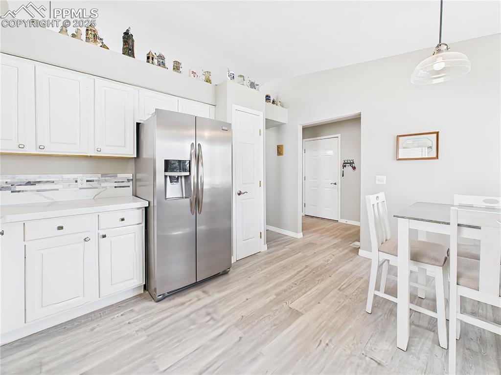 Image 11 of 49: Kitchen – Seamless flow from kitchen to casual dining, ideal for morning co