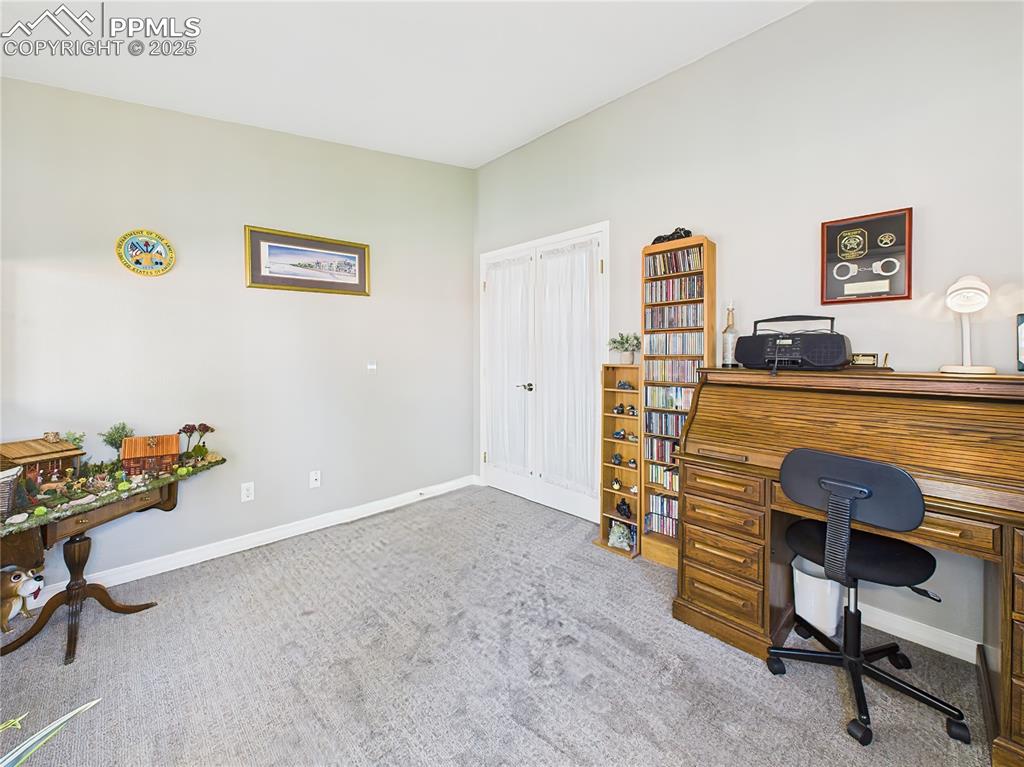 Image 22 of 49: Home Office – Features French doors, a large window for natural light, and