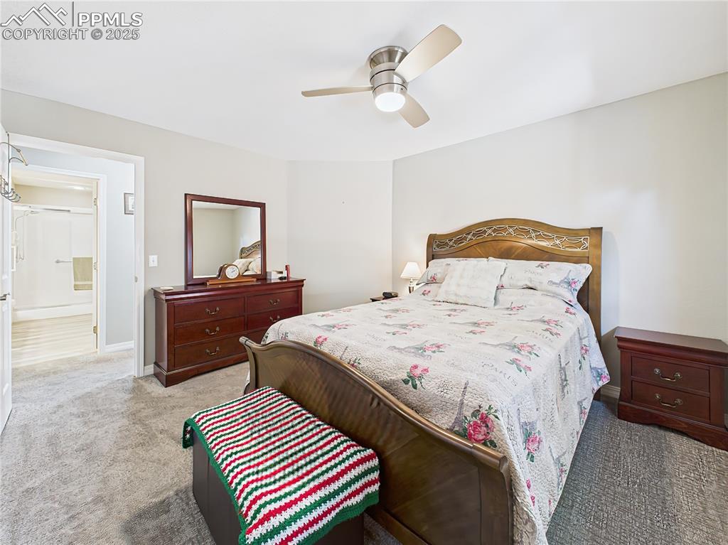 Image 31 of 49: Second Bedroom – Alternate view shows easy access to nearby bath and genero