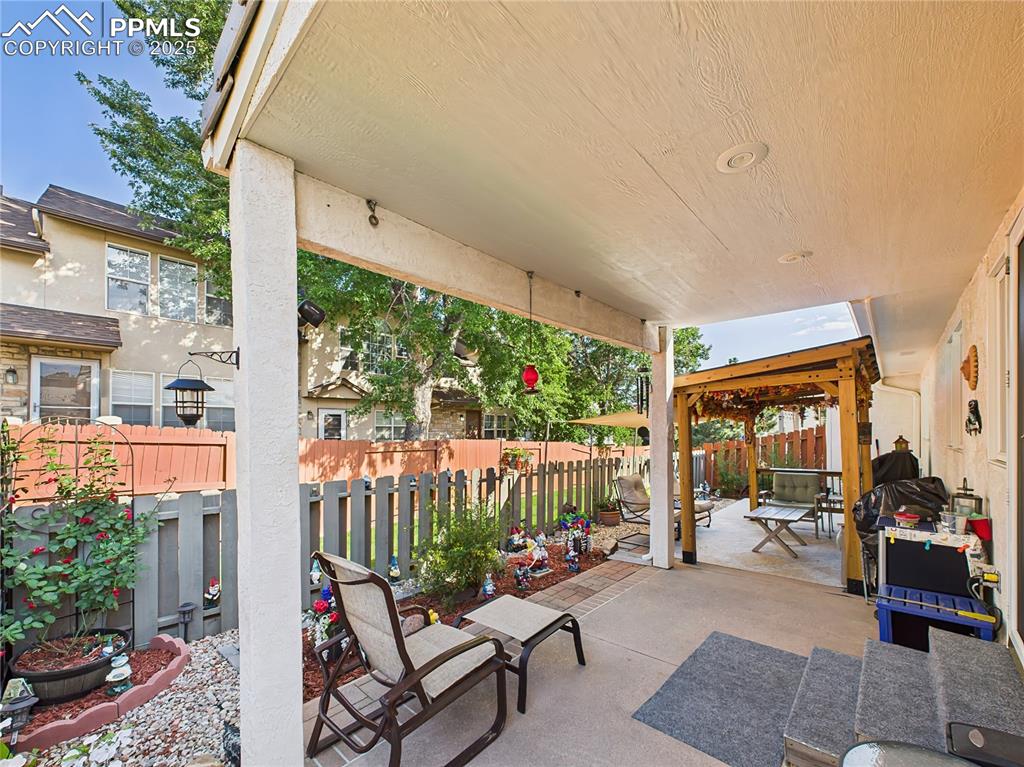 Image 38 of 49: 56. Covered Patio – Generous covered patio area offers a relaxing space for
