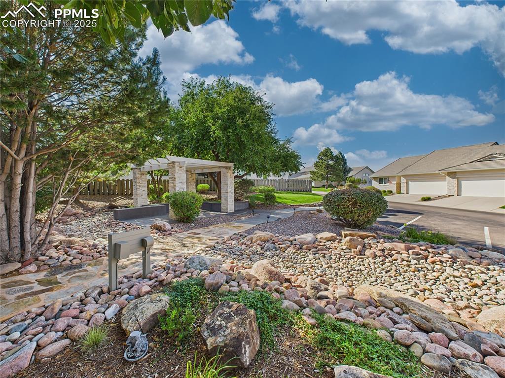 Image 45 of 49: Community Pavilion – Covered neighborhood kiosk with landscaped surrounding