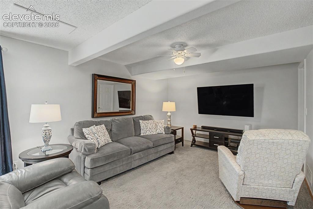 Image 19 of 36: The massive rec room provides space for a cozy theater nook
