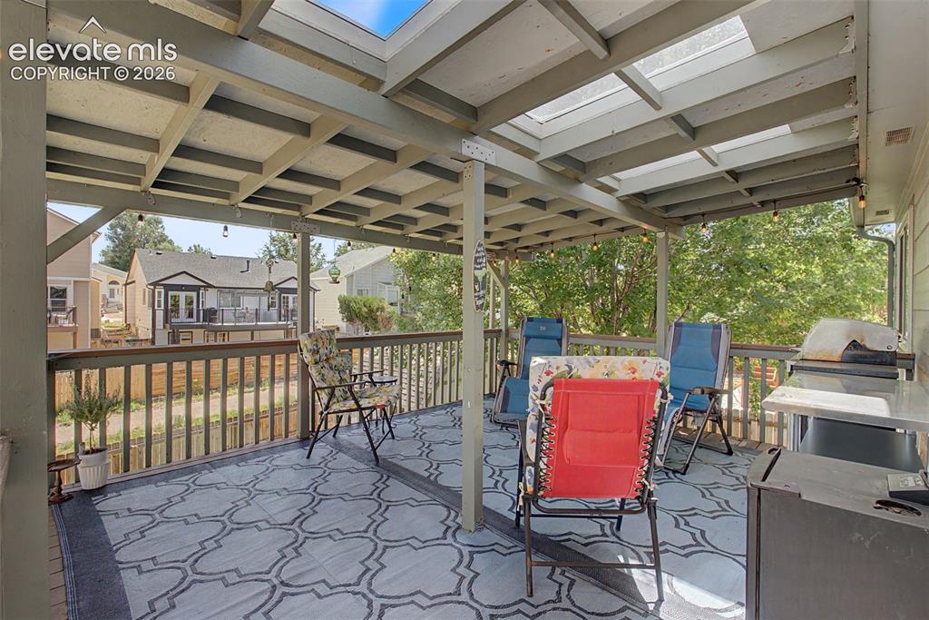 Image 28 of 36: Enjoy the sunrise or sunset from the covered deck