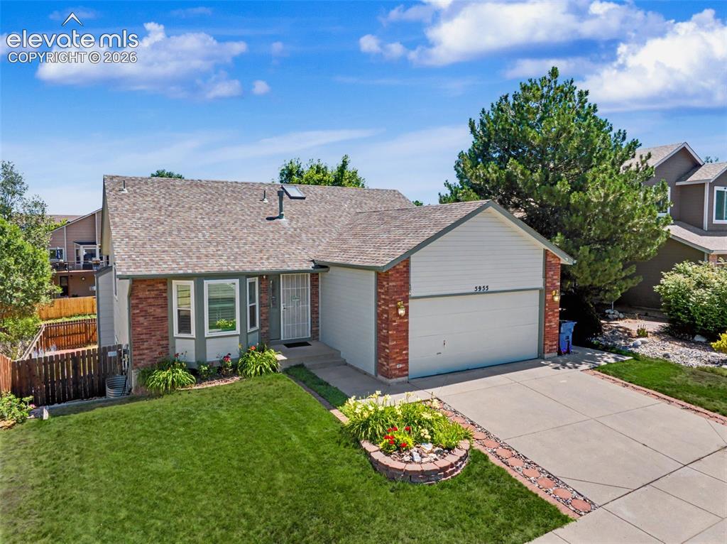 Image 5 of 36: Beautiful landscaping and a bay window give this home wonderful curb appeal