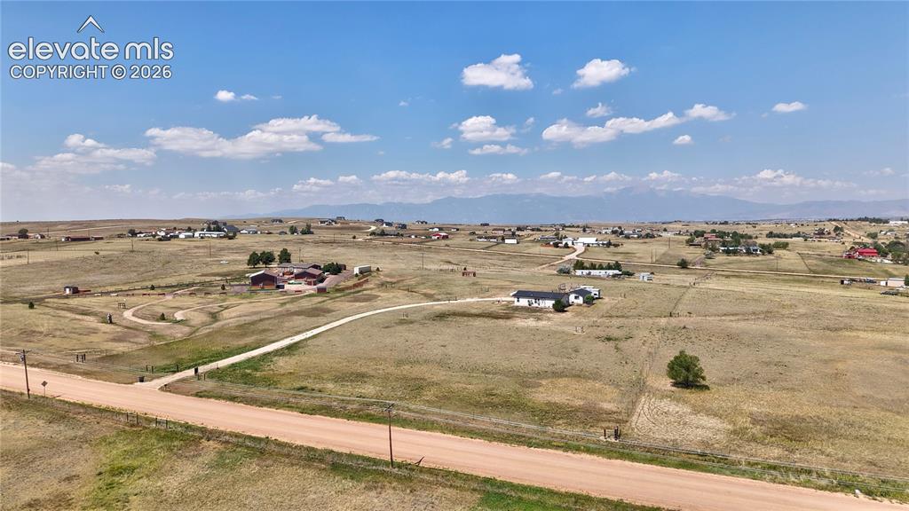 Image 6 of 36: Expansive rural landscape featuring a network of unpaved roads and scattere