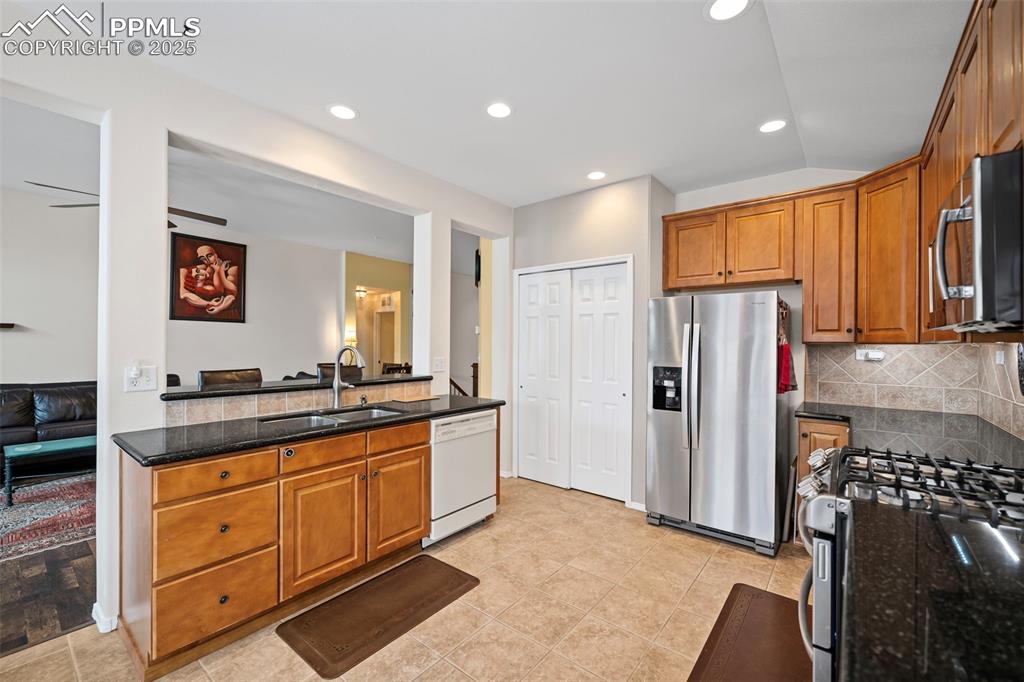 Image 5 of 30: Breakfast bar overlooking the living room and a spacious pantry