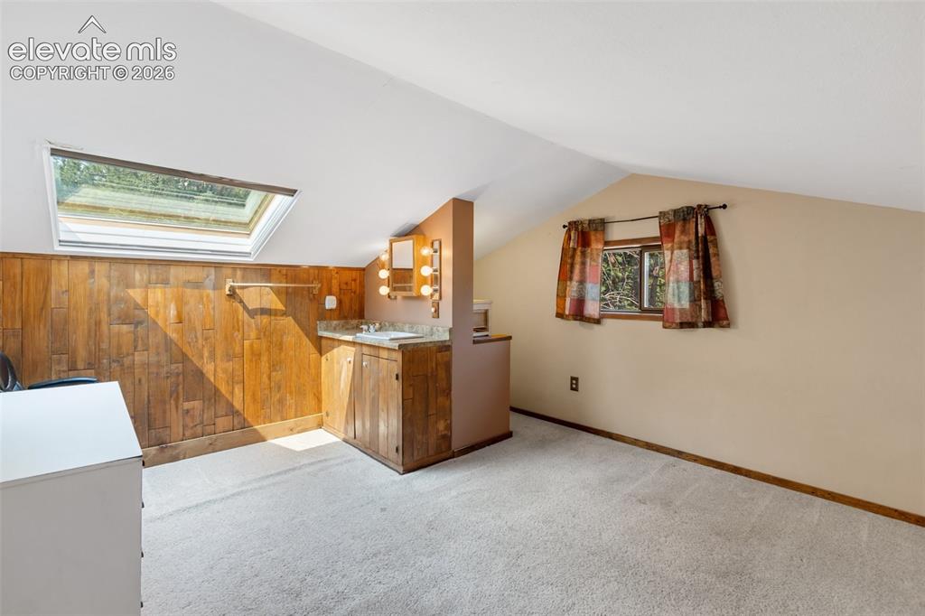Image 38 of 49: Finished attic space w/ 1/2 bath