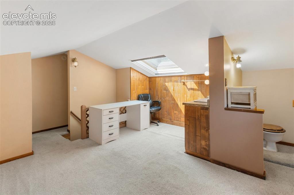 Image 39 of 49: Finished attic space w/ 1/2 bath