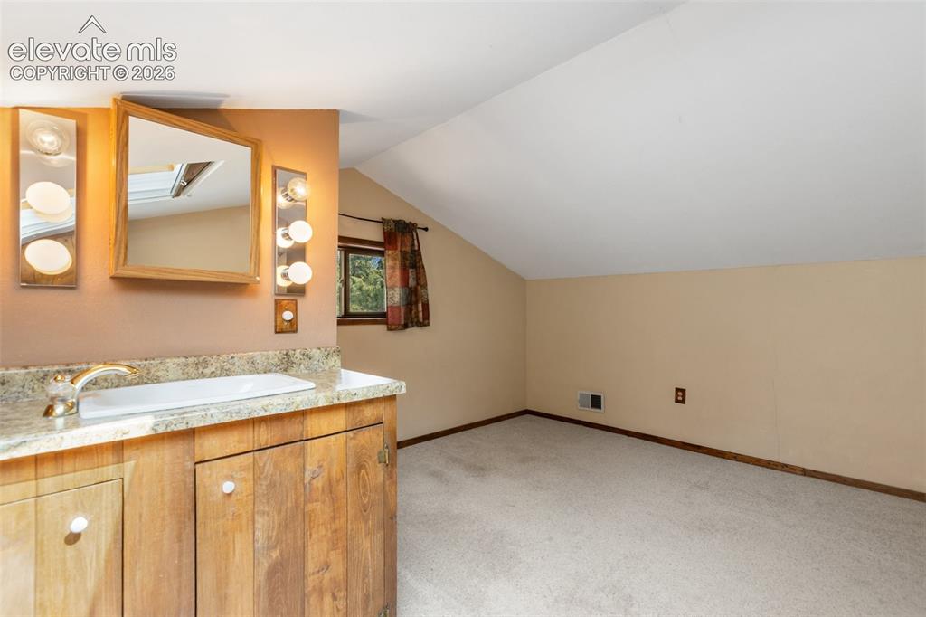 Image 40 of 49: Finished attic space w/ 1/w bath