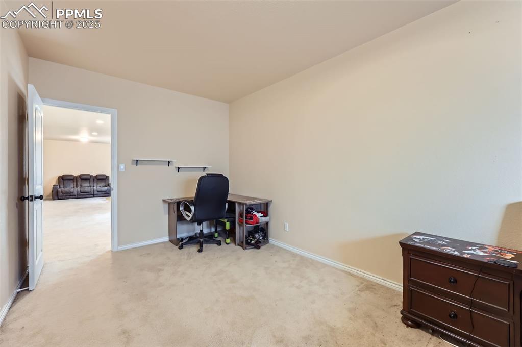Image 26 of 29: featuring light colored carpet and baseboards