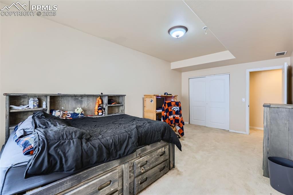 Image 29 of 29: Bedroom with carpet and baseboards