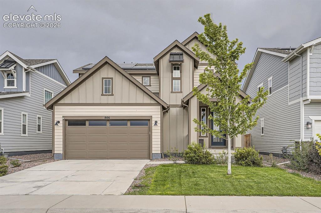Image 1 of 28: Contemporary two-story residence featuring board and batten siding, horizon