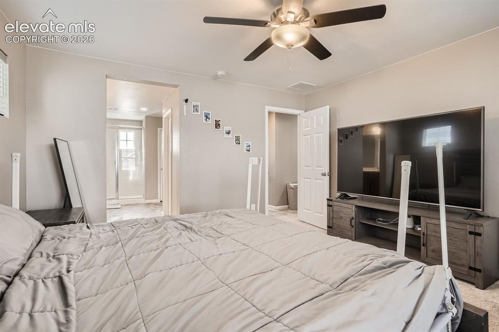 Image 14 of 28: Carpeted interior space featuring light neutral wall paint