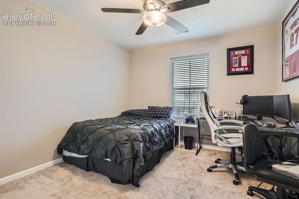 Image 19 of 28: Bedroom featuring neutral-toned walls and carpet flooring