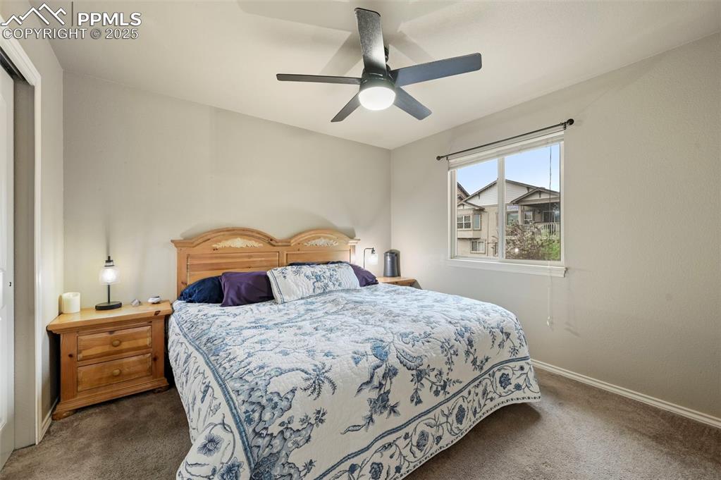 Image 23 of 50: Bedroom featuring carpet, a ceiling fan, and a closet