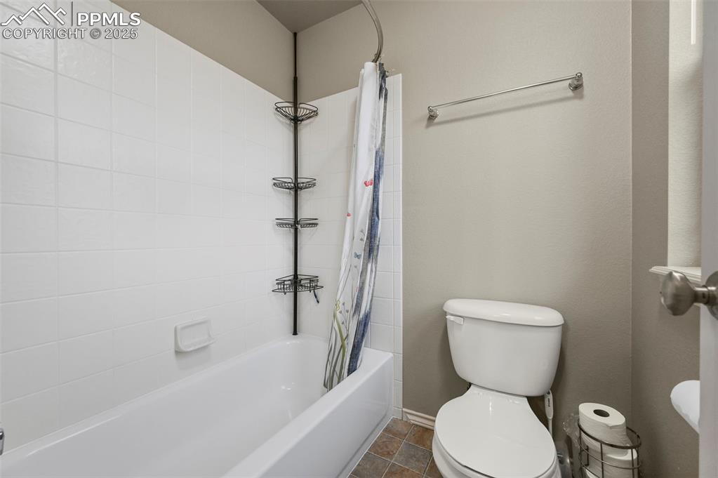 Image 26 of 50: Full bath with toilet and shower / tub combo