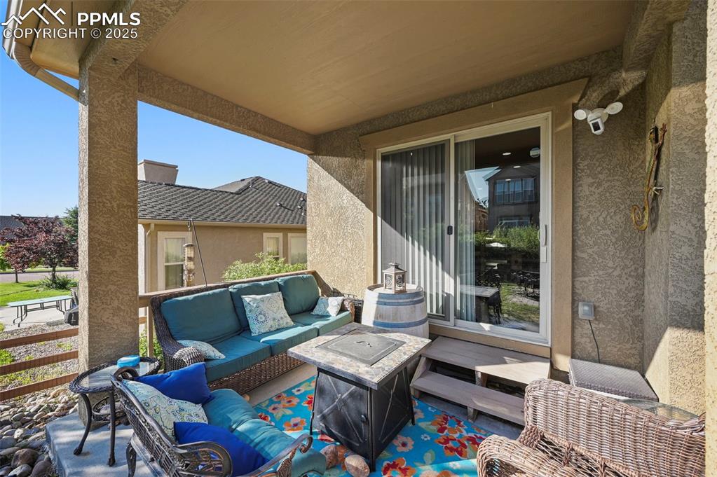Image 40 of 50: View of patio featuring an outdoor hangout area