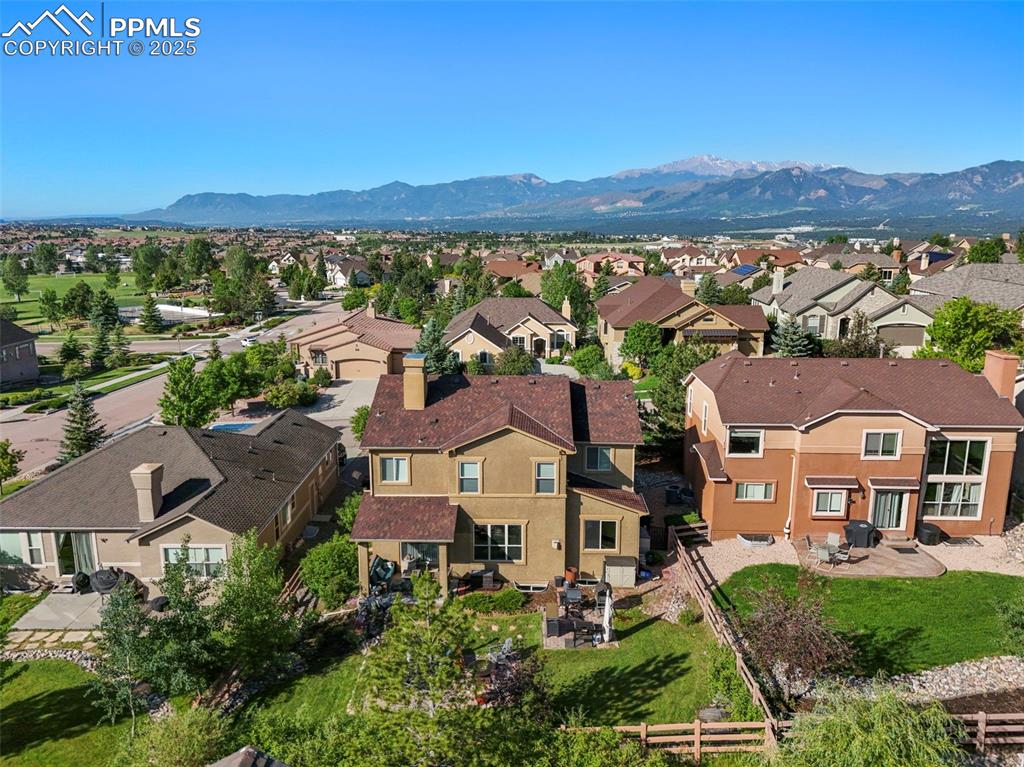 Image 45 of 50: Aerial view of residential area with mountains