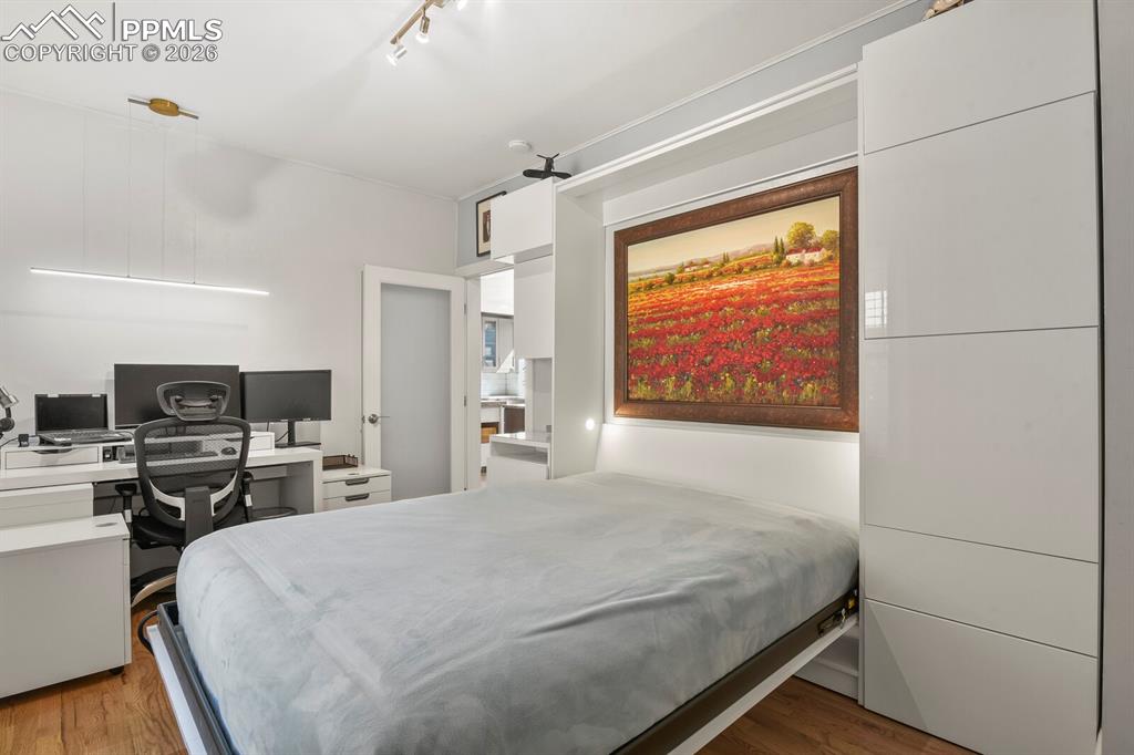 Image 22 of 50: main level bedroom with murphy bed 