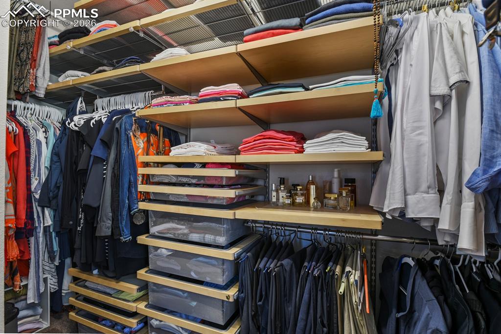 Image 26 of 50: New custom built-in closet in primary bedroom