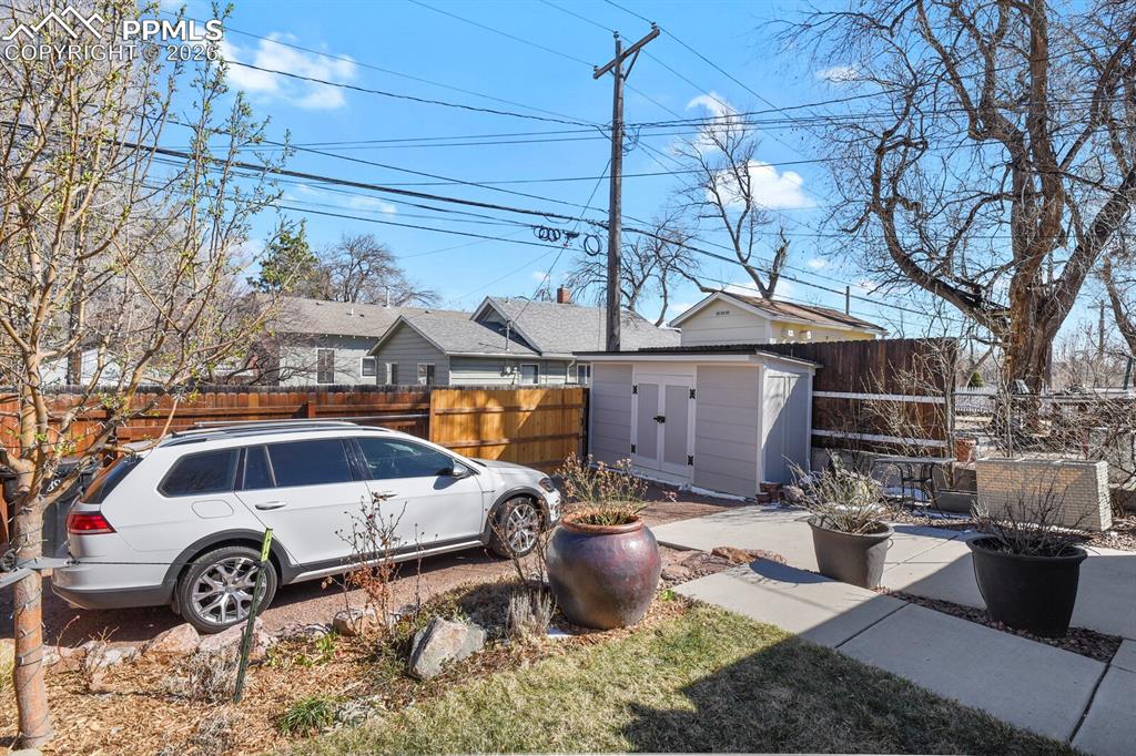 Image 45 of 50: Additonal parking off the back alley and another storage shed! 