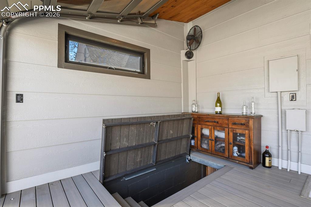 Image 47 of 50: Stairs leading down to the basement for additonal storage 