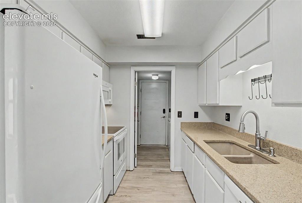 Image 11 of 30: laundry room and back door