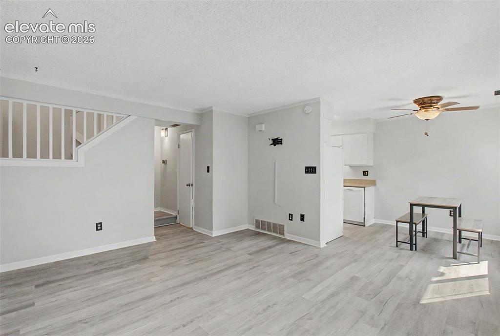 Image 8 of 30: Facing the dining area and kitchen beyond