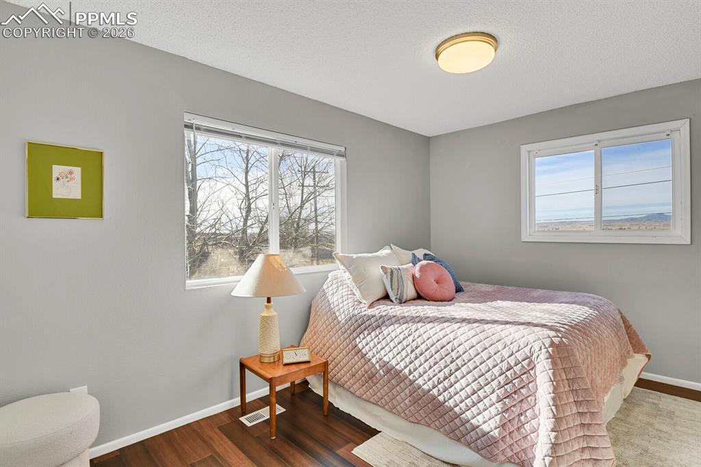 Image 12 of 47: Primary Bedroom, Upper Level, you’ll love waking up to those stunning views