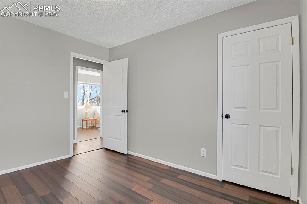 Image 20 of 47: Lower Level Bedroom #4, staged as an office