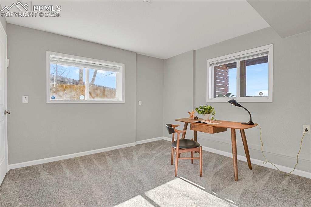 Image 21 of 47: Lower Level Bedroom #4, staged as an office
