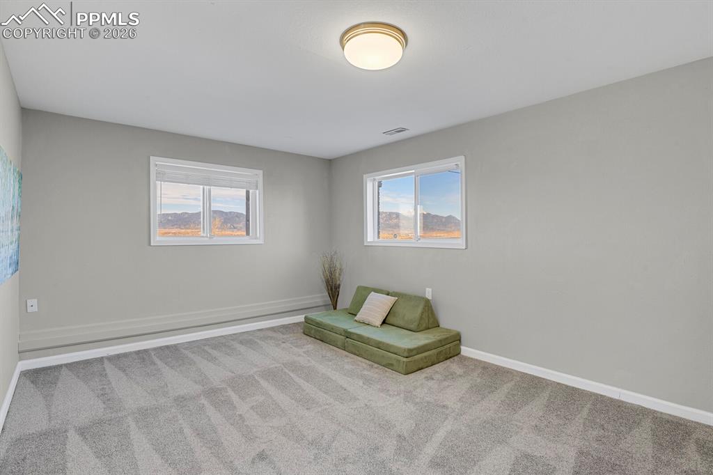 Image 24 of 47: Lower Level Great Room is large and has access to the amazing views