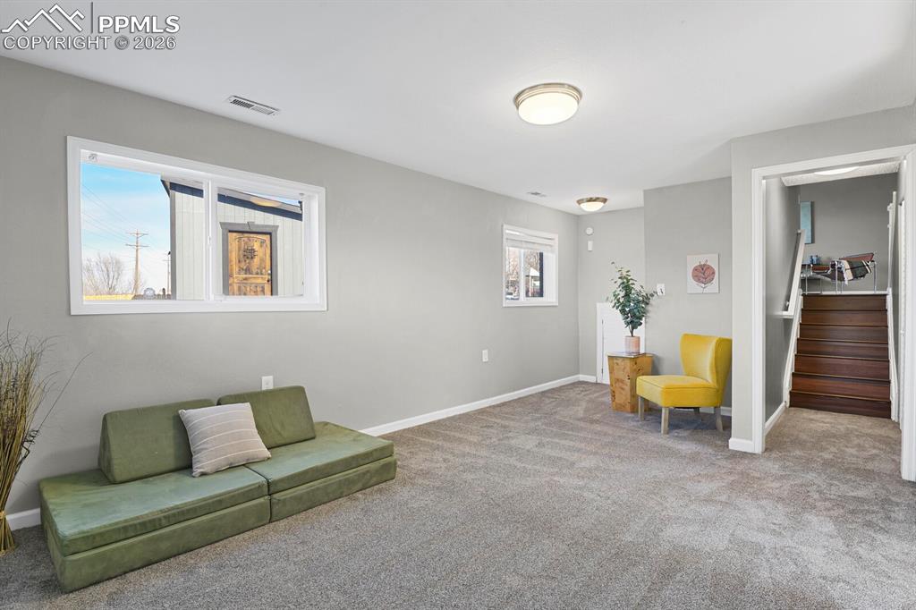 Image 26 of 47: Lower Level Great Room is large and has access to the amazing views