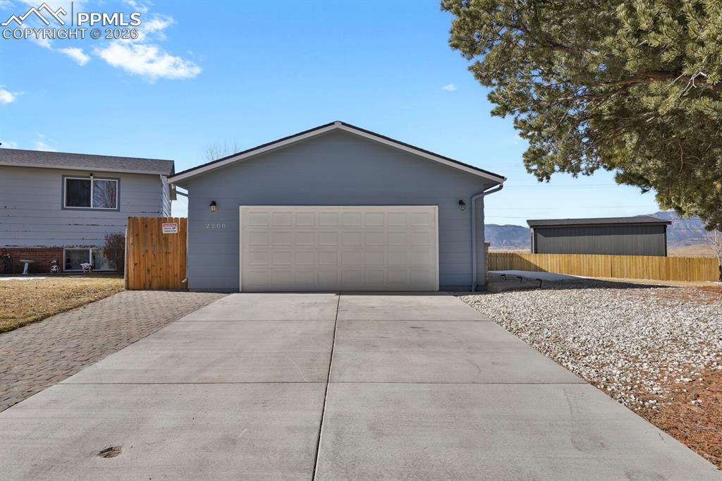 Image 30 of 47: New driveway provides ample parking for multiple vehicles