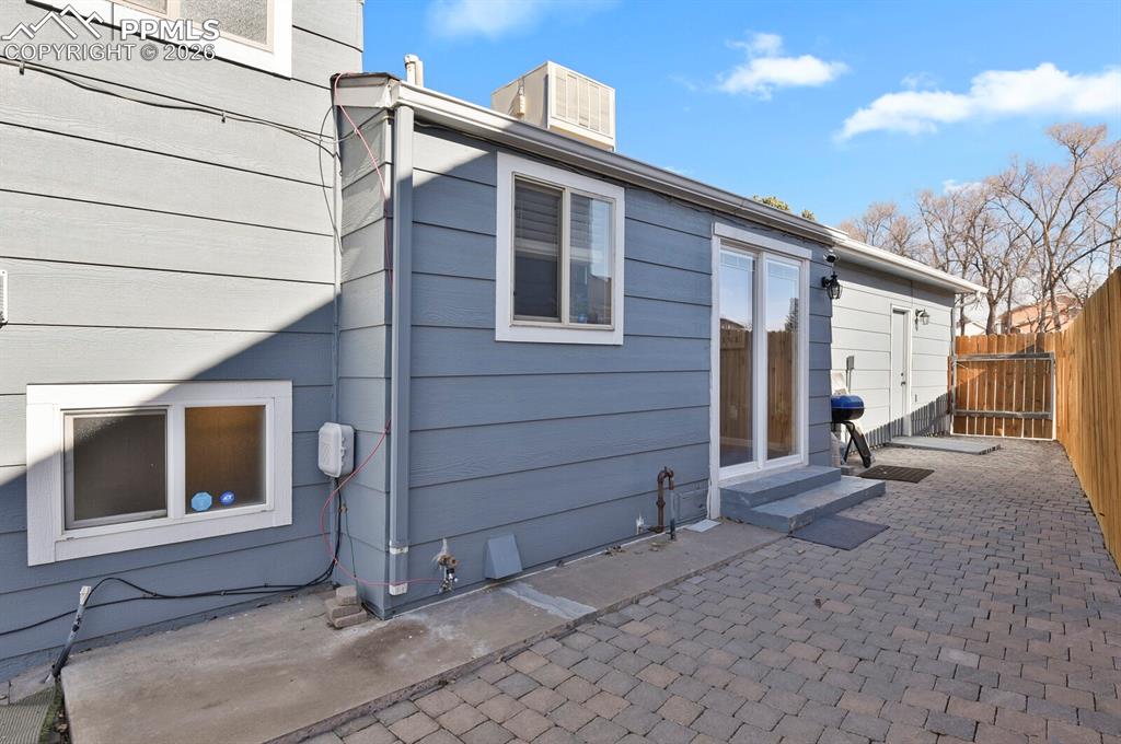 Image 33 of 47: Side patio, with access to Eat-In-Kitchen