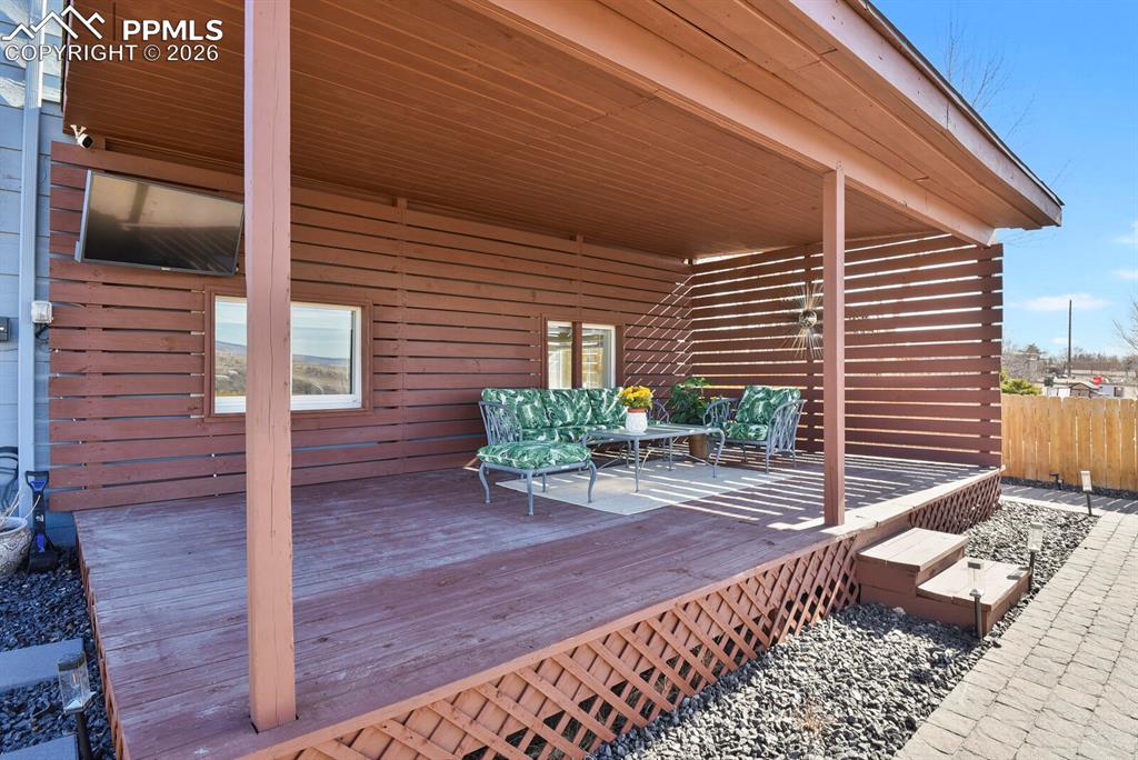 Image 35 of 47: Enjoy the beautiful views and Colorado weather from this huge covered deck