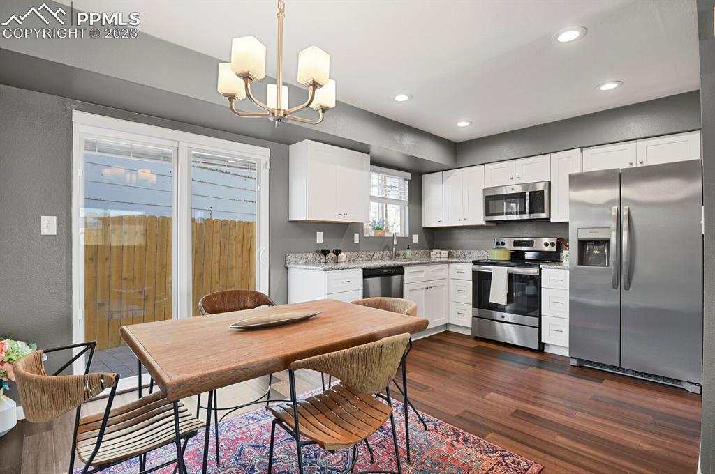 Image 6 of 47: Front Door looking East to Driveway