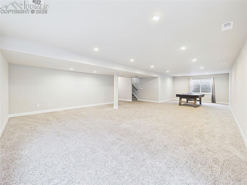 Image 31 of 50: Basement view from alternate angle emphasizing generous square footage and 