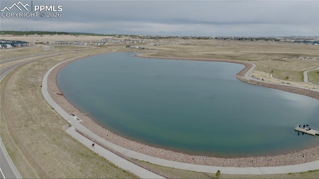 Image 42 of 50: Wolf Lake offers walking paths and a dock, offering peaceful water views an