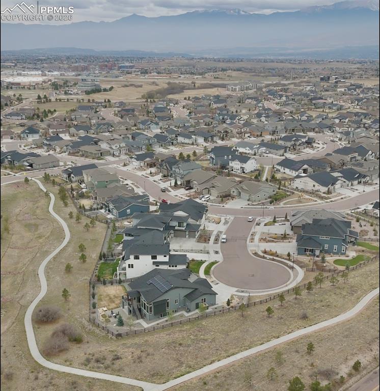 Image 44 of 50: Community walking trails wind through the neighborhood, connecting open spa