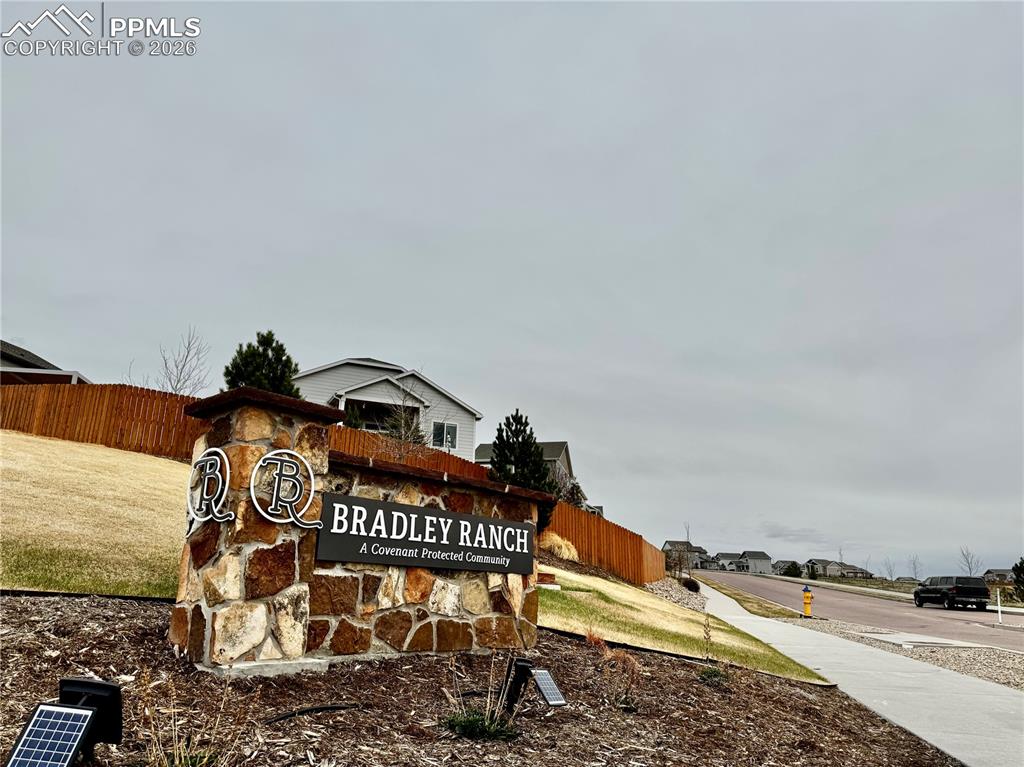 Image 45 of 50: Entrance monument for Bradley Ranch, showcasing a well-maintained and coven
